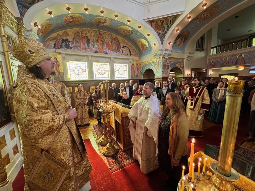 Photo of newly ordained receiving word of encouragement.